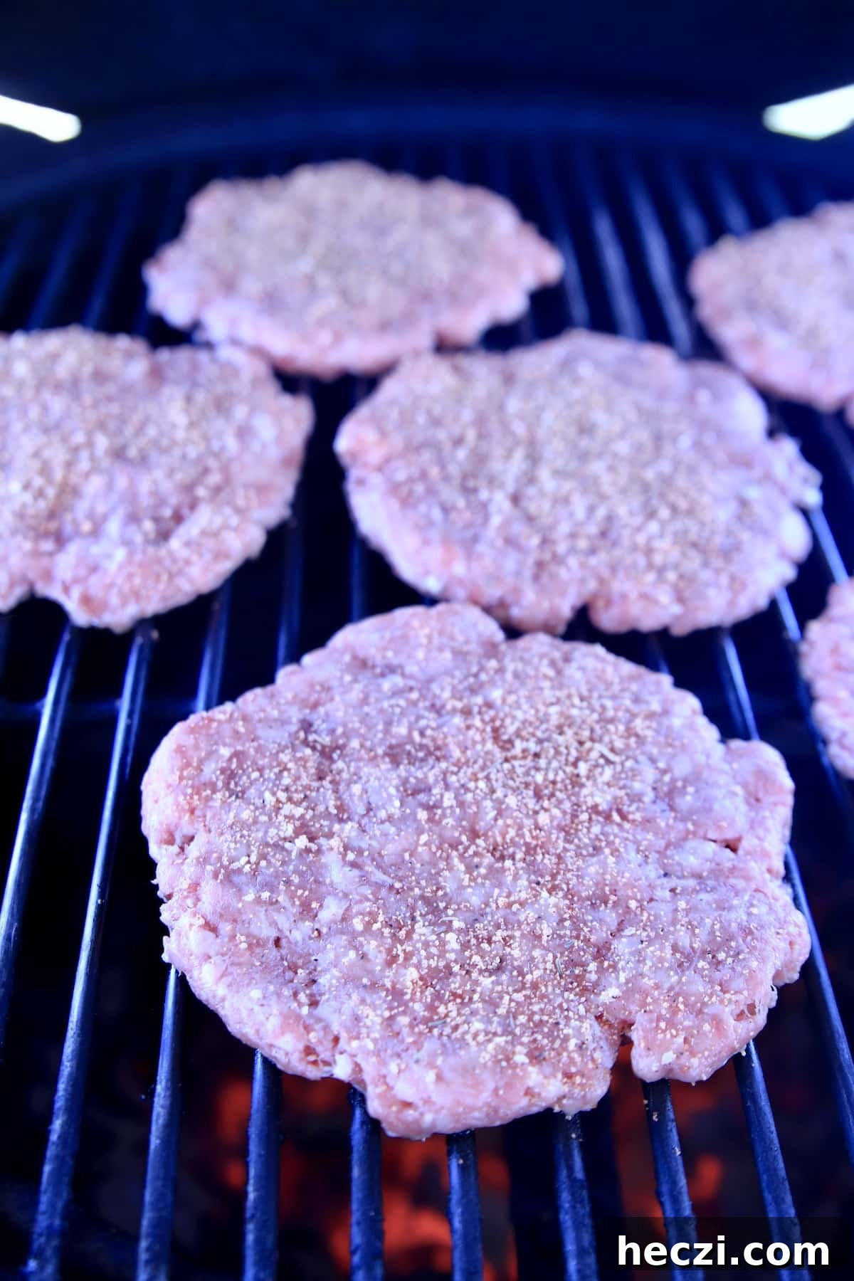 Burger patties on a grill.