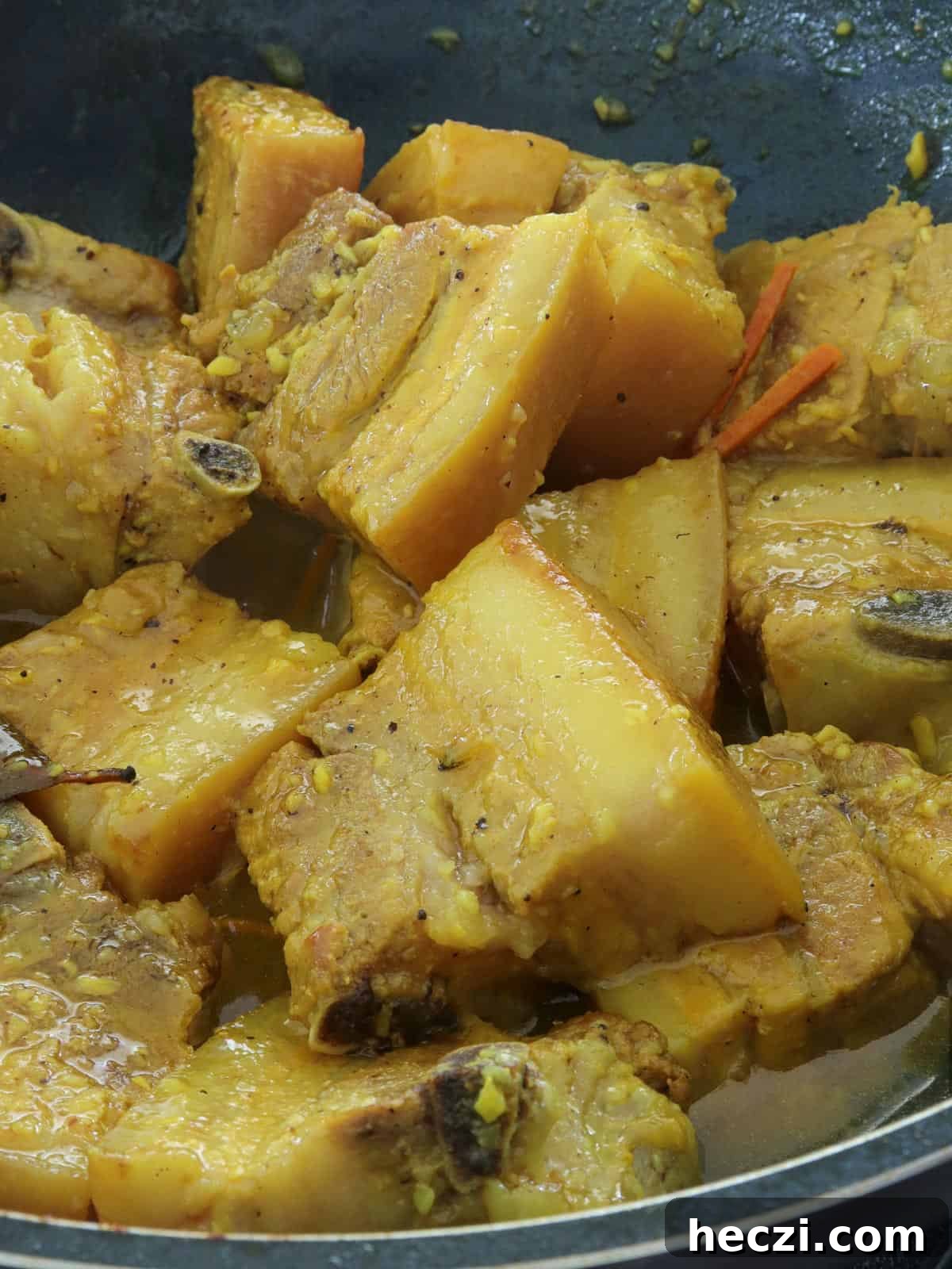 Adobong Dilaw: Filipino Yellow Adobo Recipe with Turmeric and Coconut Milk 2 Adobong Dilaw in a pan