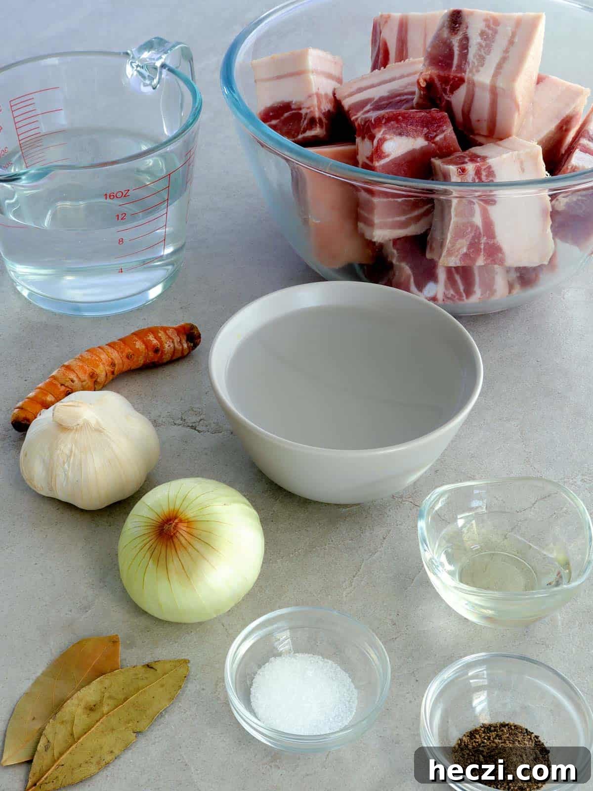 Adobong Dilaw: Filipino Yellow Adobo Recipe with Turmeric and Coconut Milk 3 pork cubes, garlic, turmeric, vinegar, water, onion, oil, salt, pepper