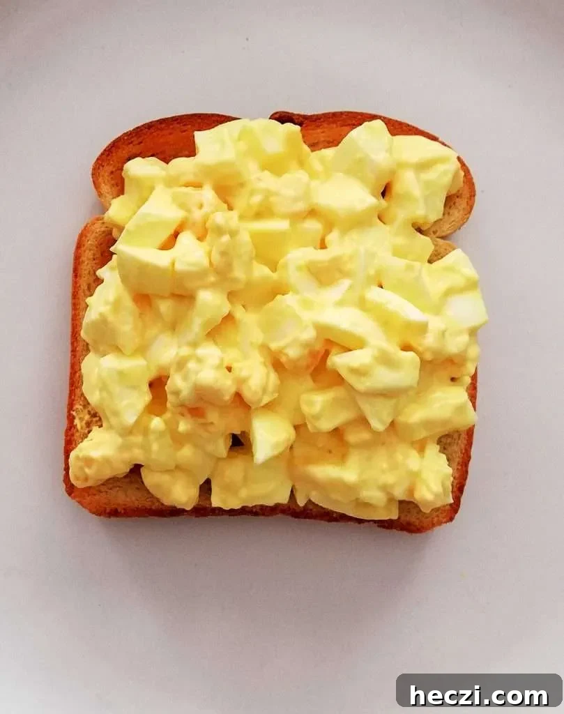 egg salad sandwich egg salad on top of toasted toast
