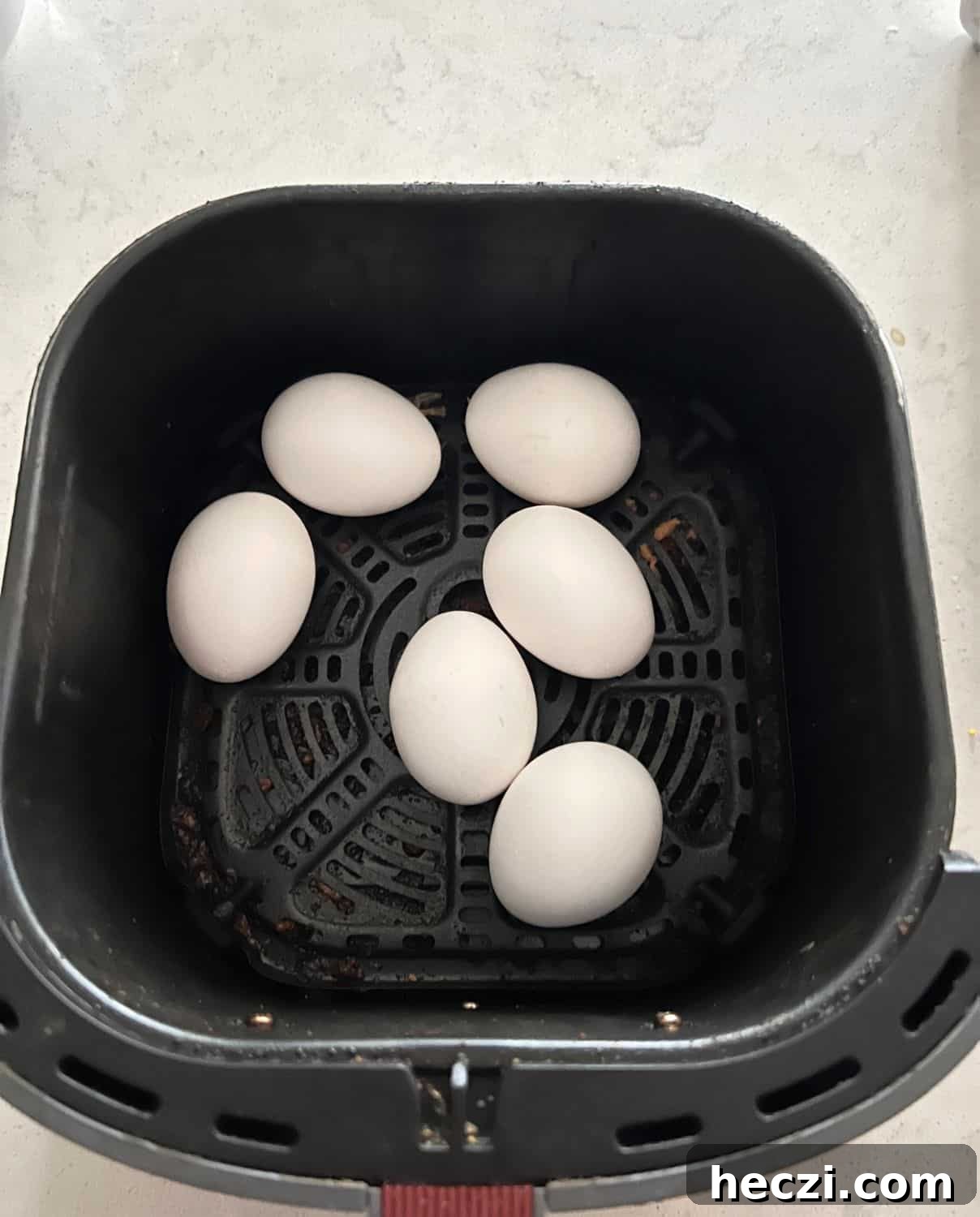 Air Fryer Hard boiled eggs in basket. 