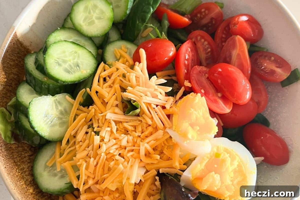 Cobb salad ingredients in a bowl. 