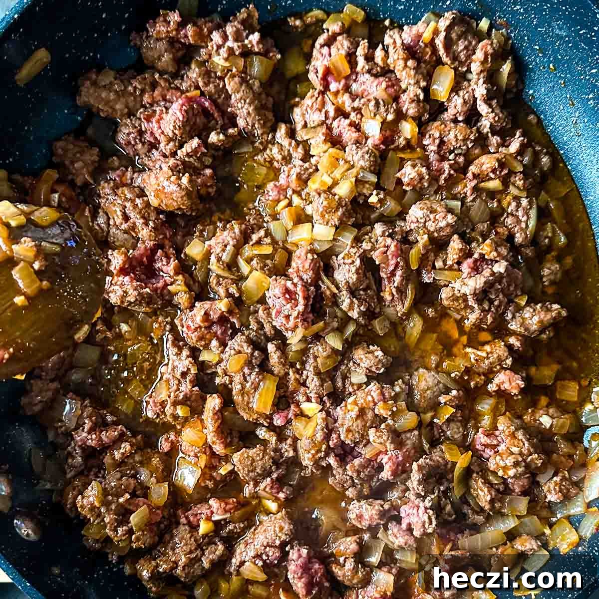 Slow Cooker Lamb Ragu: Tender Rustic Pasta Sauce Recipe 11 browned lamb with onion, garlic, tomato paste, and chili flakes.