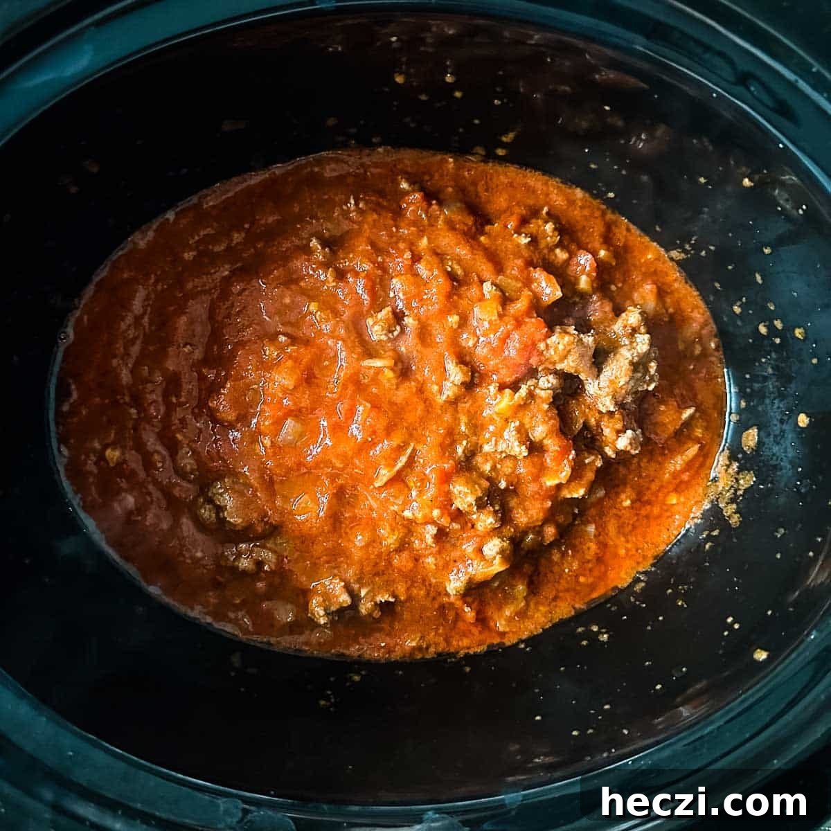 Slow Cooker Lamb Ragu: Tender Rustic Pasta Sauce Recipe 14 lamb ragu is transferred to a slow cooker.