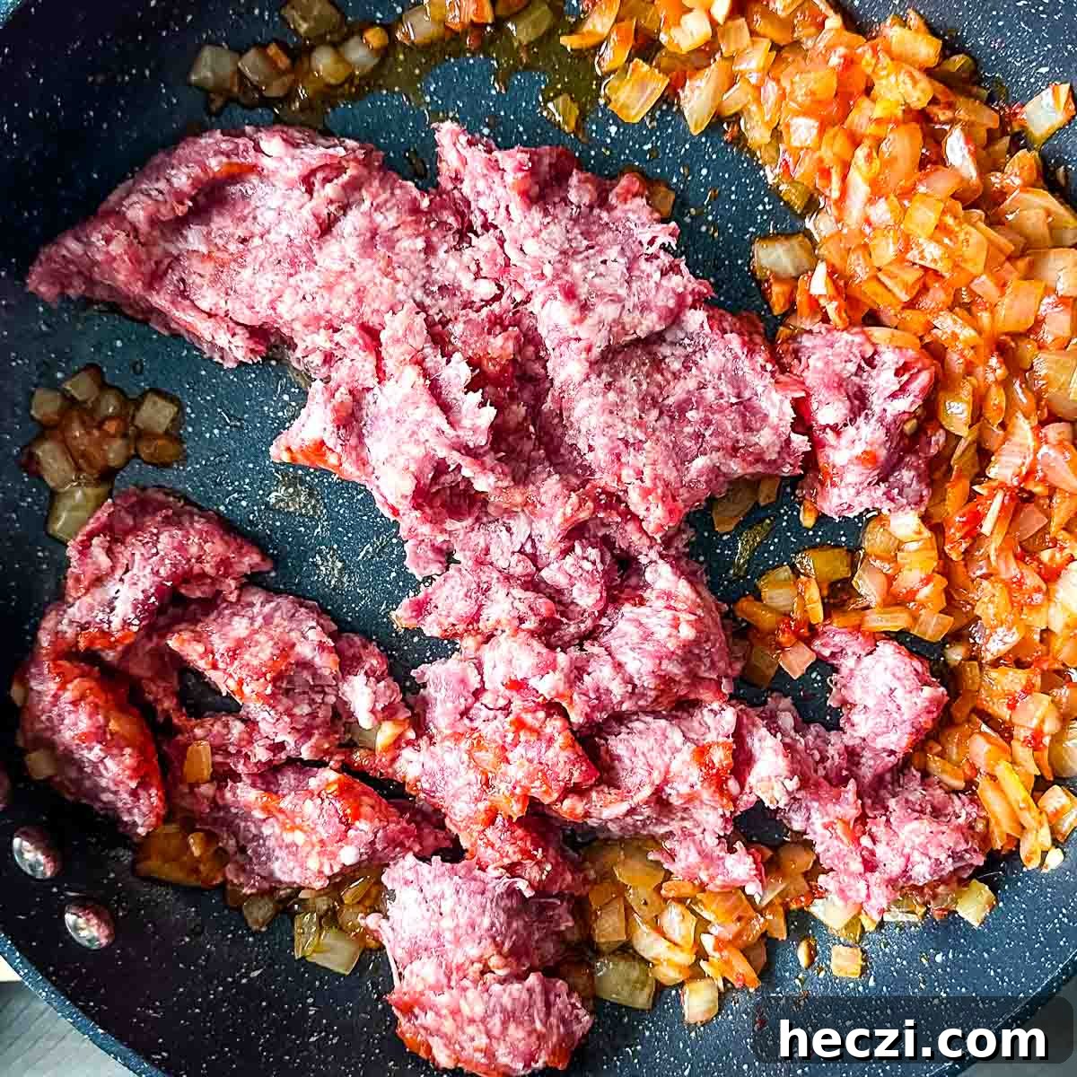 Slow Cooker Lamb Ragu: Tender Rustic Pasta Sauce Recipe 10 adding raw ground lamb to lamb ragu.