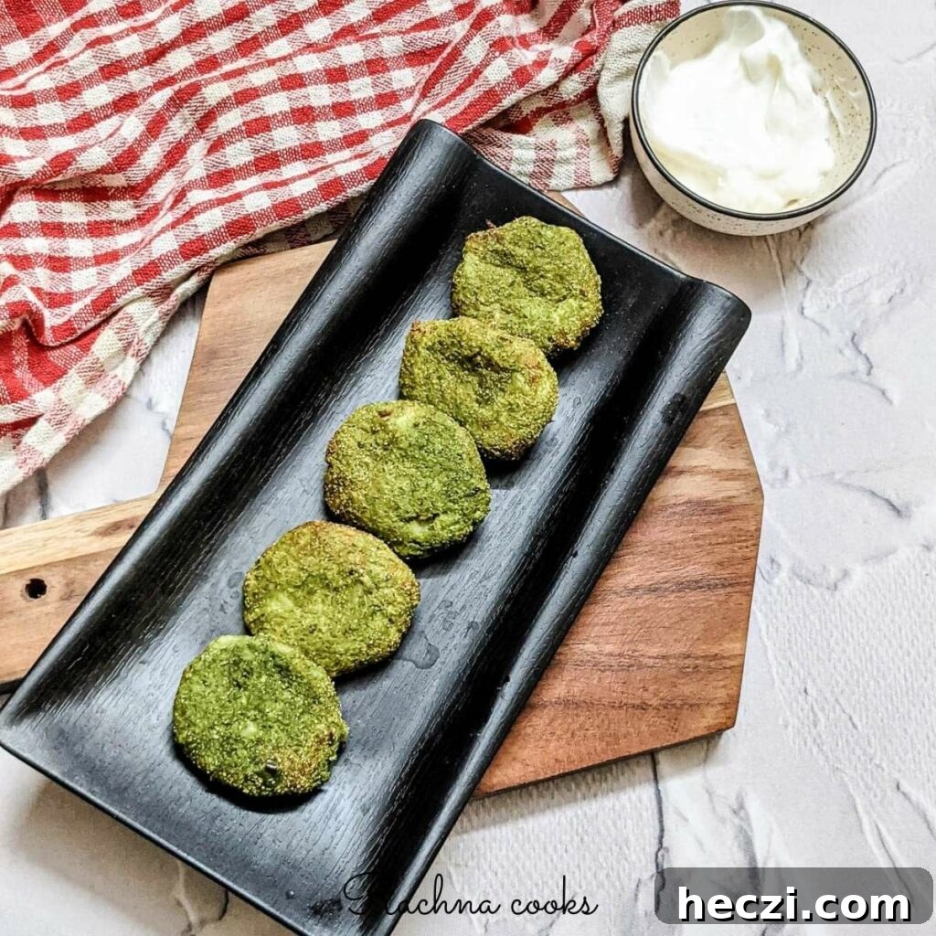 Hara Bhara Kabab Recipe — Tawa and Air Fryer Methods 2 tasty hara bhara kebab on a black platter with mayo