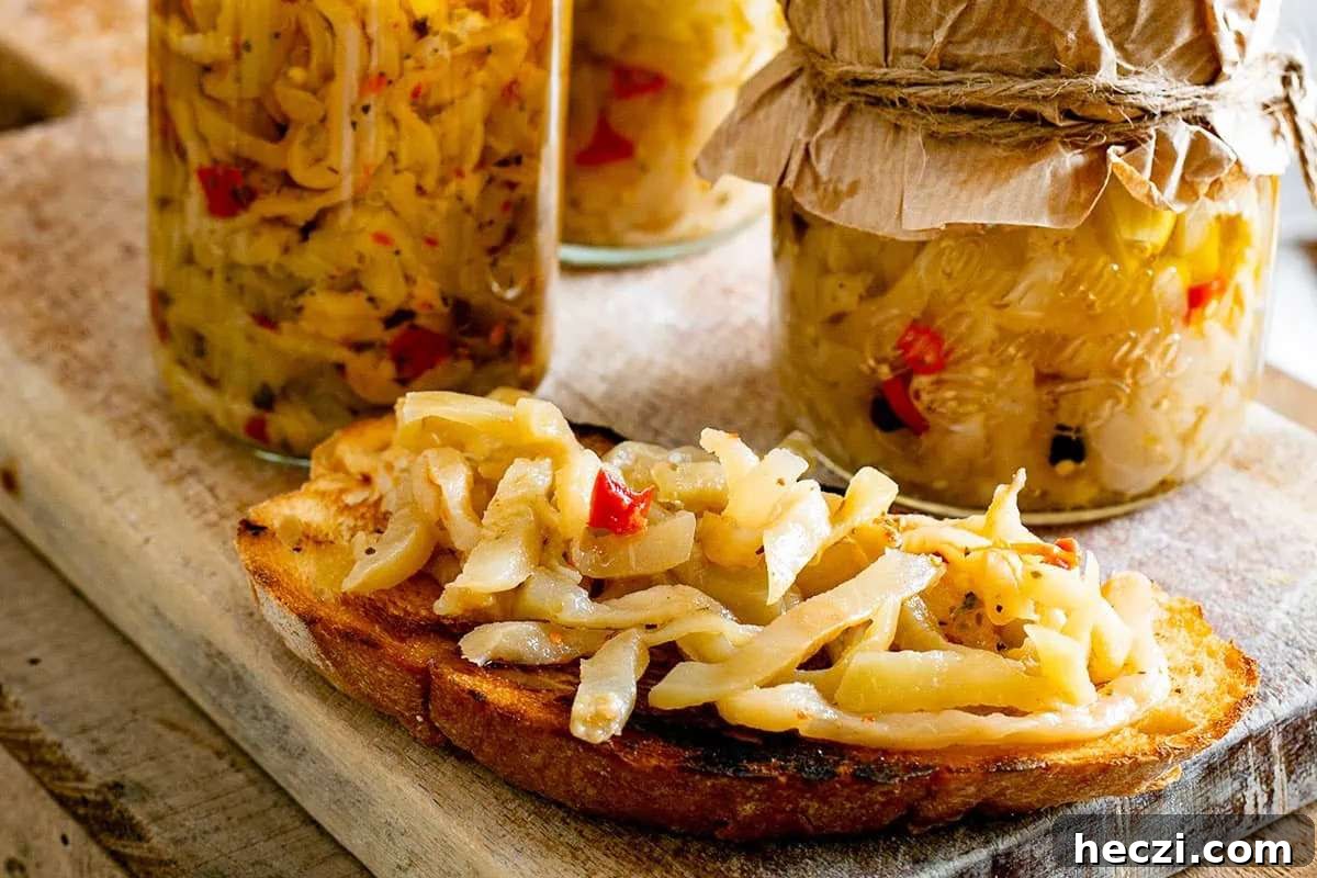 Two jars of pickles and bread on a cutting board, perfect for Italian appetizers.