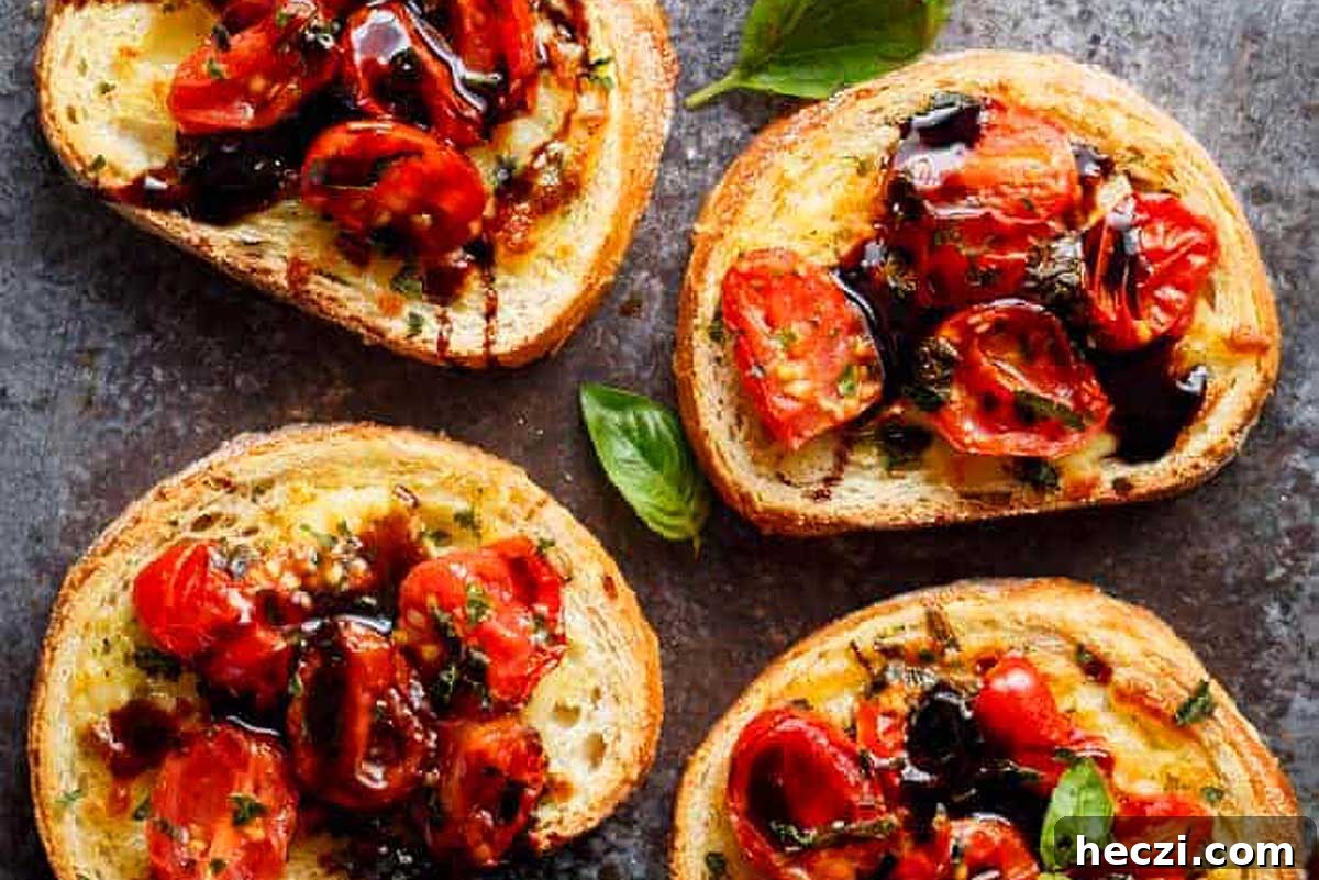 Four slices of bread topped with tomatoes and basil, creating delicious Italian appetizers.