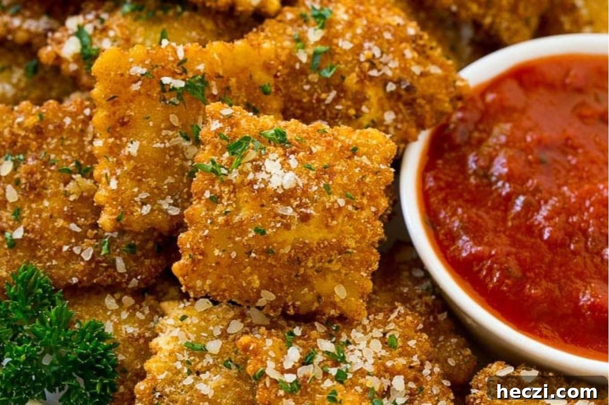 An appetizing plate of cheesy Italian crackers with a delectable dipping sauce.