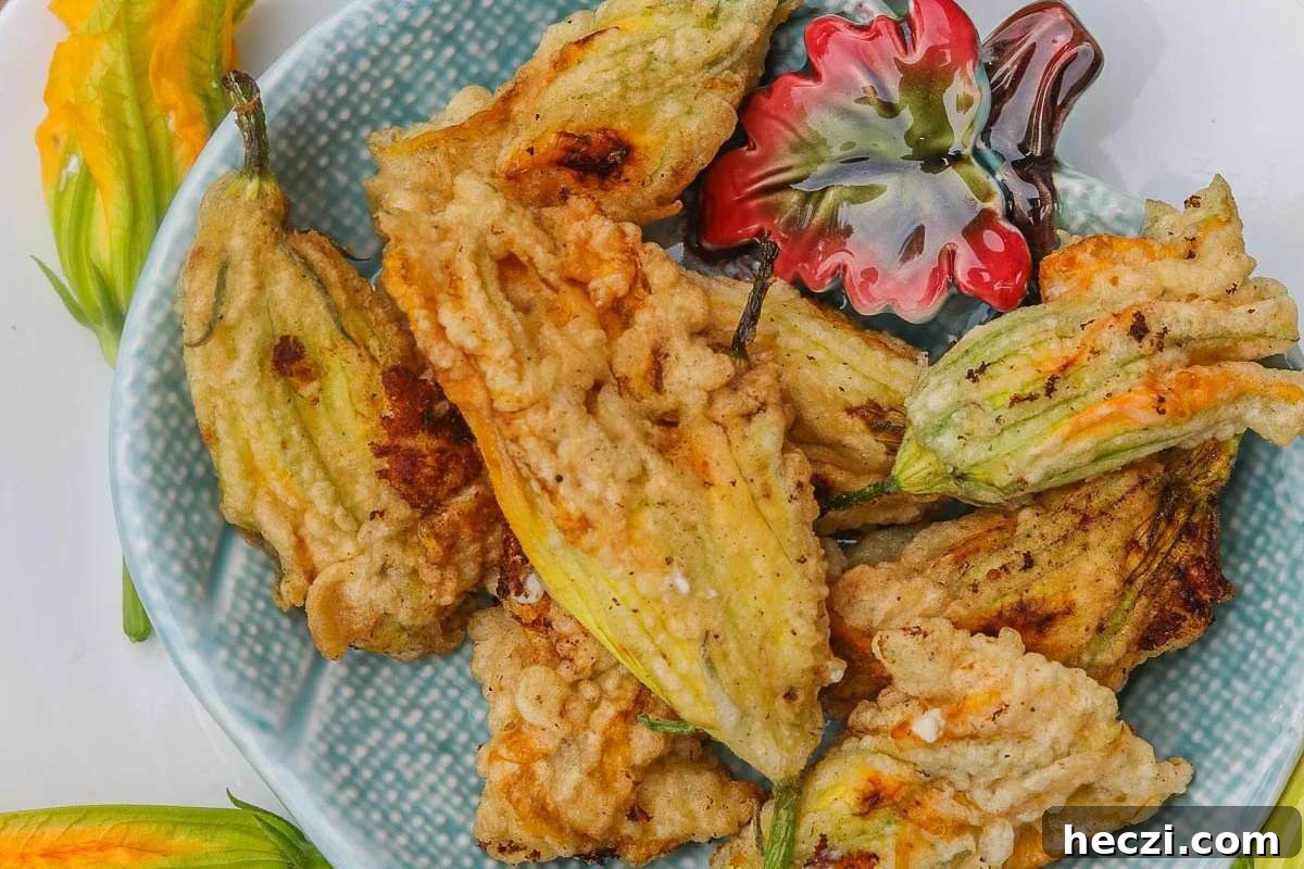 Italian-style fried zucchini flower appetizer on a plate.