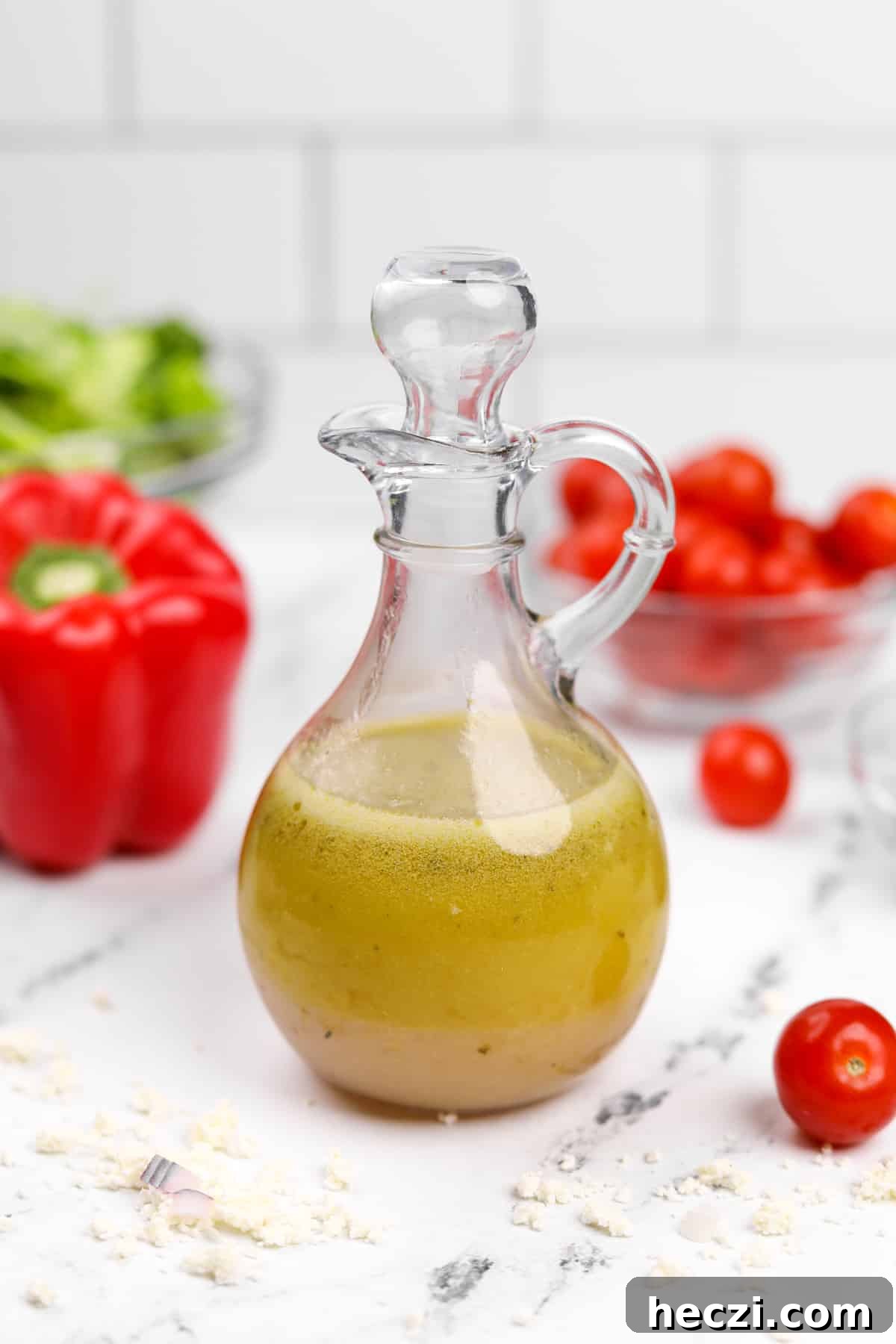 Authentic Greek Vinaigrette Recipe for Salads and Marinades 6 A salad dressing cruet filled halfway with an olive oil based dressing.