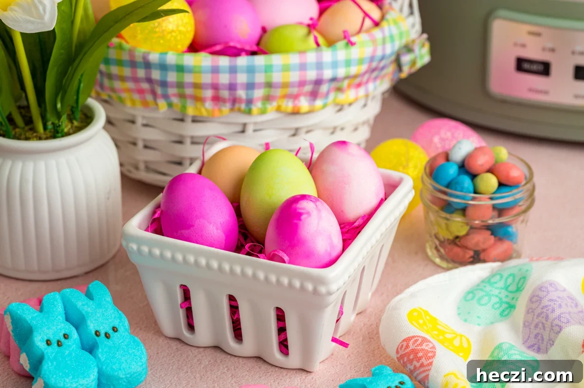 Slow cooker easter eggs in  a small white basket with more in the background.