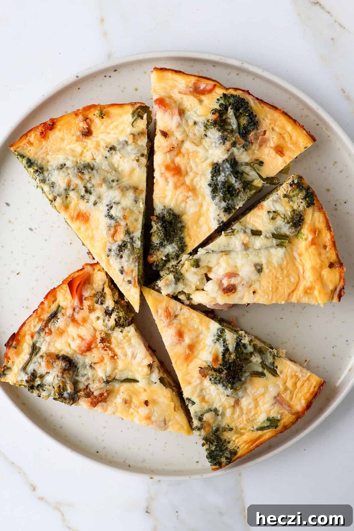 Ham and Broccolini Frittata Recipe for Brunch or Dinner 11 Broccolini frittata slices on a plate.