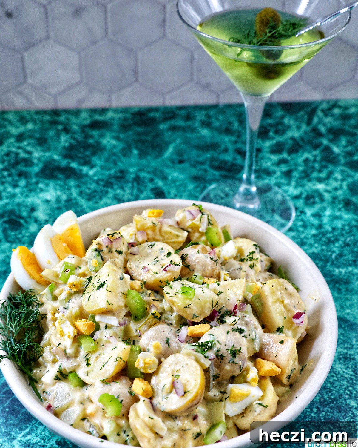 Creamy Dill Pickle Potato Salad Recipe 14 bowl of dill pickle potato salad and a dill pickle martini.