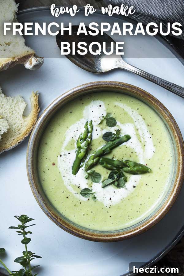 Close up of a bowl of soup with text overlay - French Asparagus Bisque.