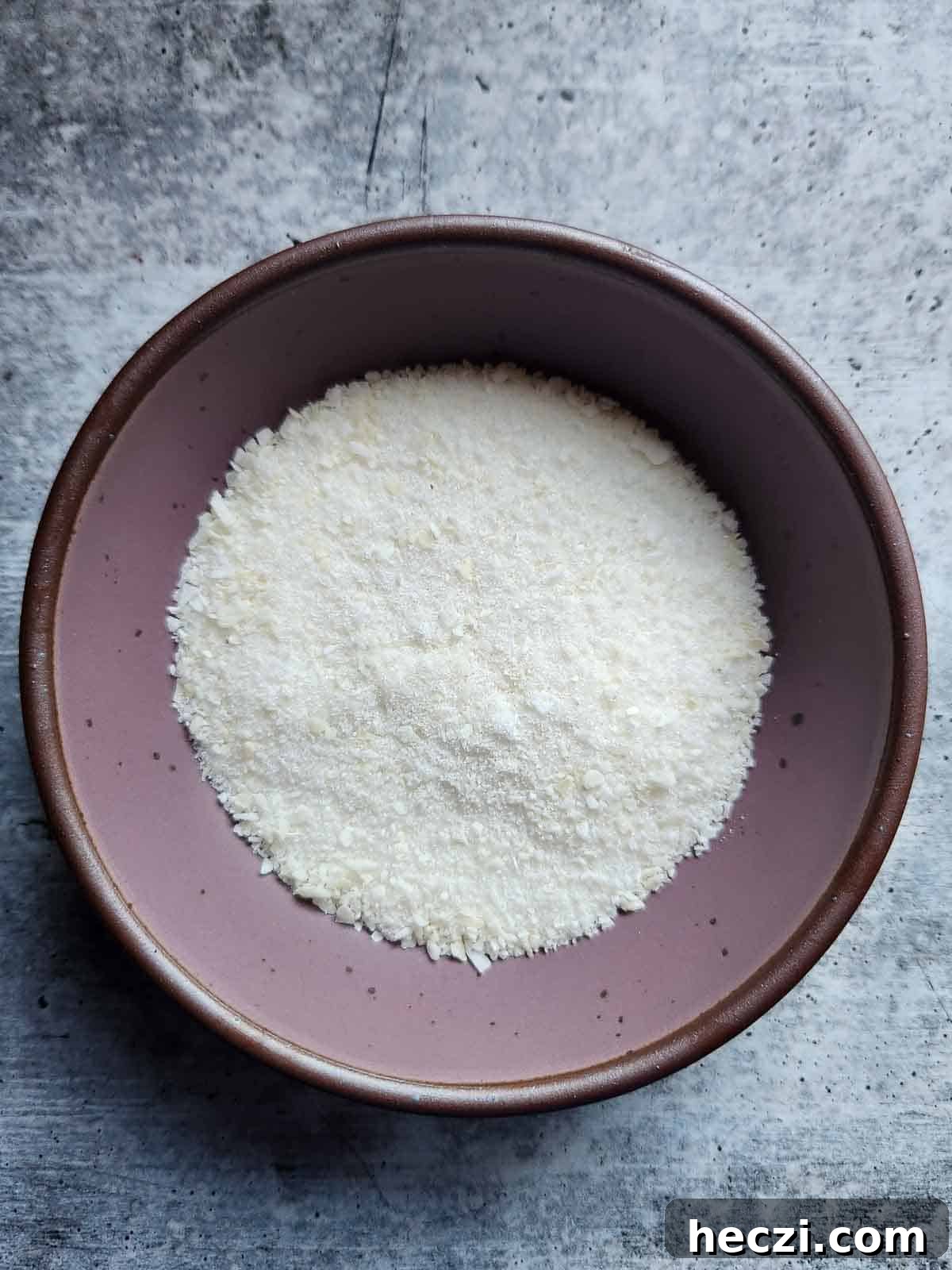 Coconut Oatmeal Cookie Recipe — Chewy Coconut Oatmeal Cookies 4 Coconut sugar in a purple bowl.