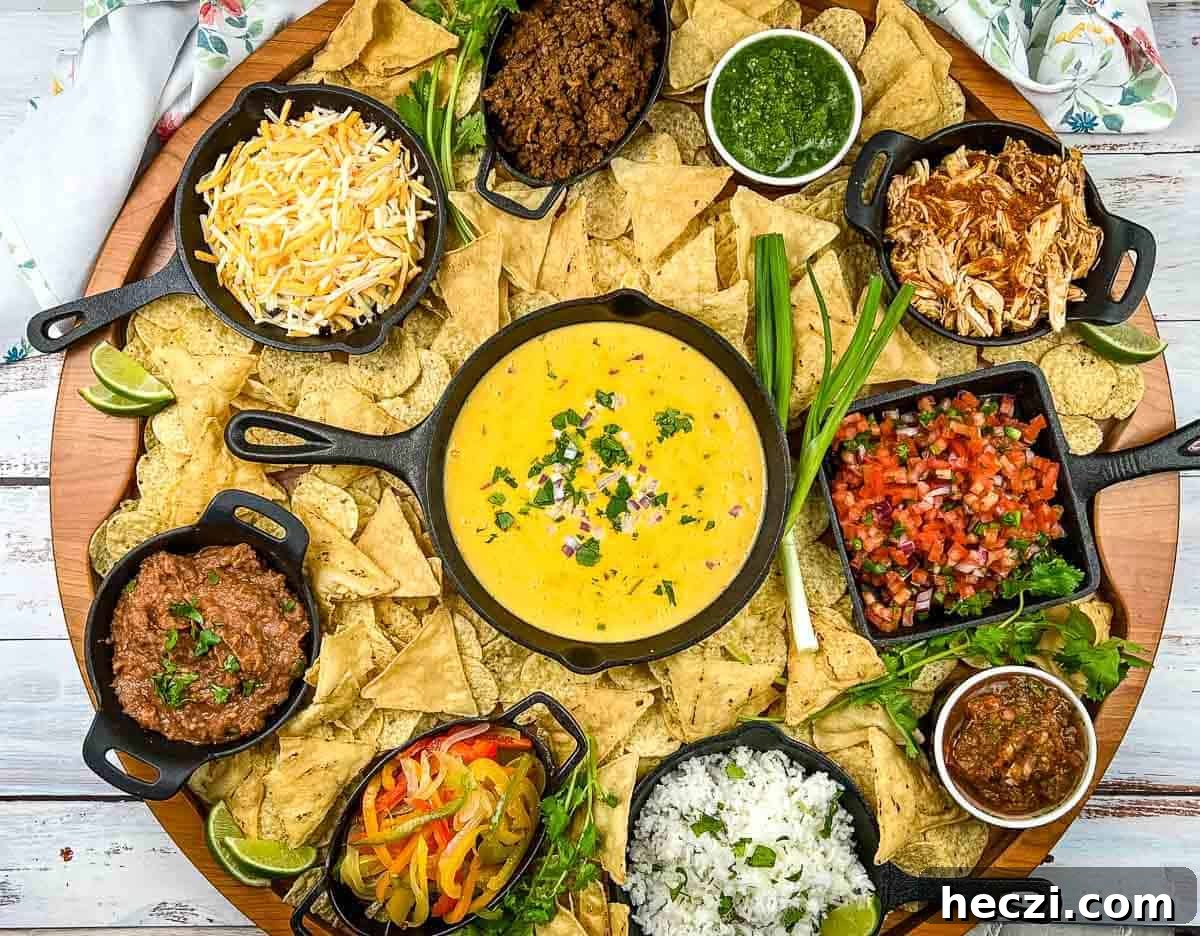 A platter of nachos with different toppings.