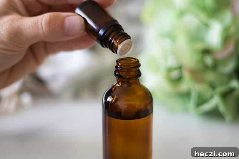 Adding essential oils to a homemade mattress spray.