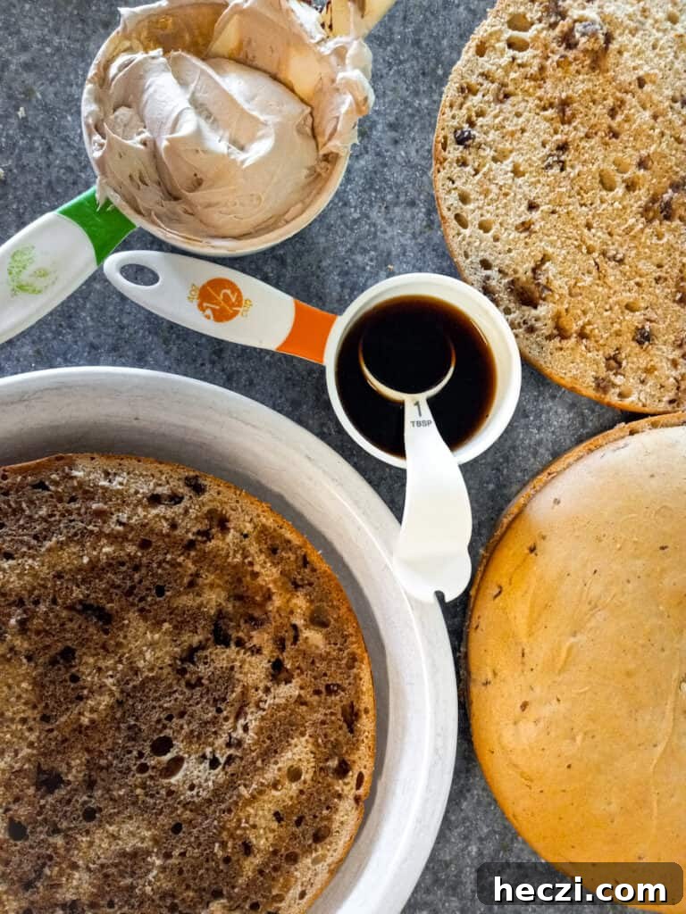 Tiramisu Torte: Layered Coffee Mascarpone Cake Recipe 7 drizzling coffee over sliced cakes.