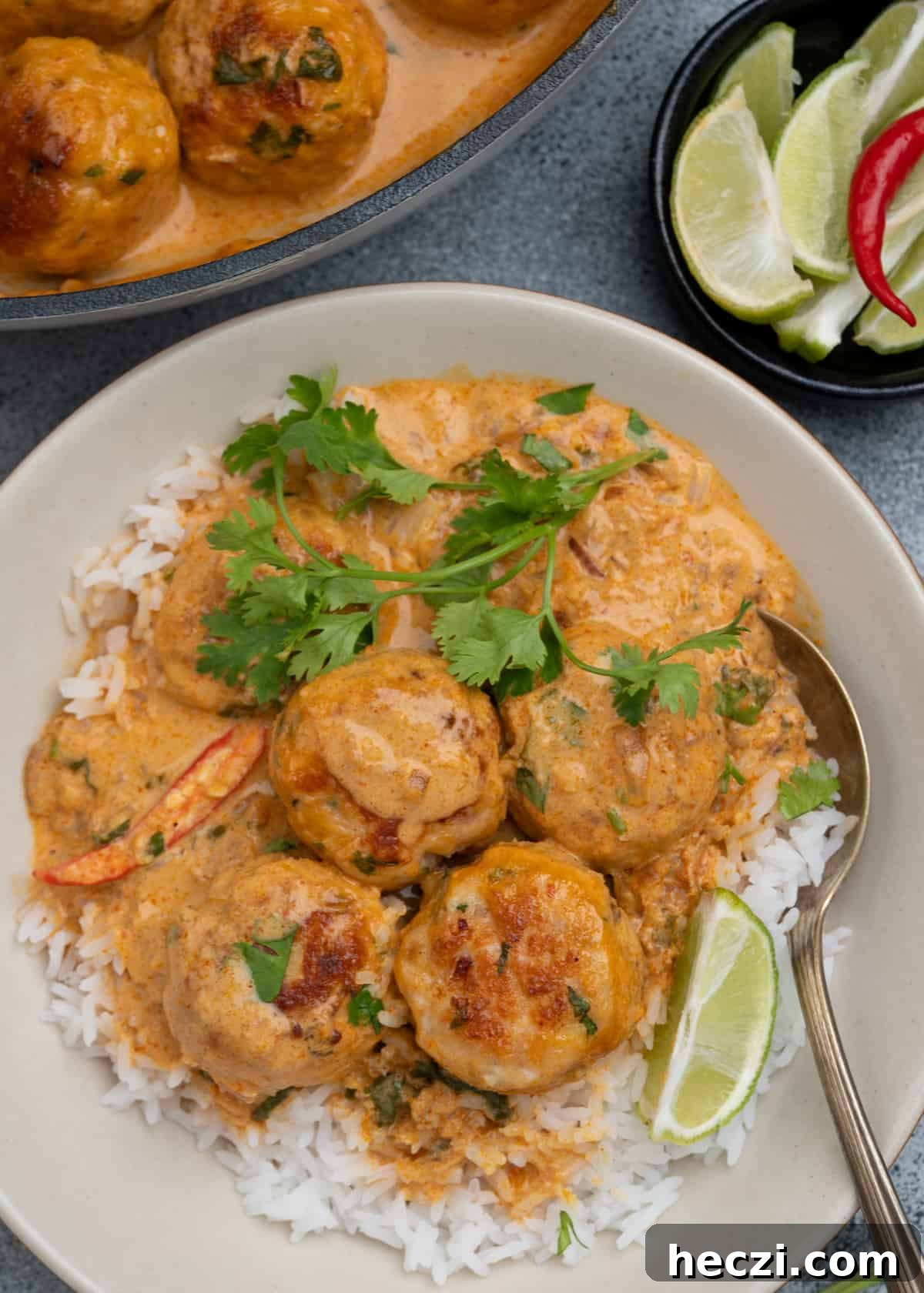 Thai meatballs with creamy coconut sauce served over rice. 