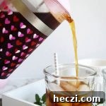 French Press Cold Brew Coffee: Smooth, Strong Cold Brew Recipe 8 pouring cold brew into cup