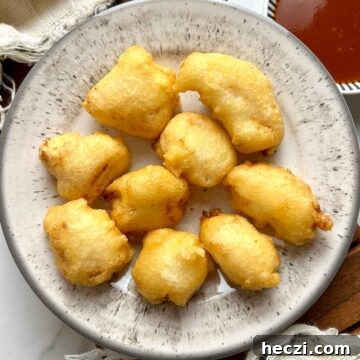 Crispy Chinese Chicken Balls in Classic Sweet and Sour Sauce 12 overhead shot of chicken balls on plate with side of sweet and sour sauce