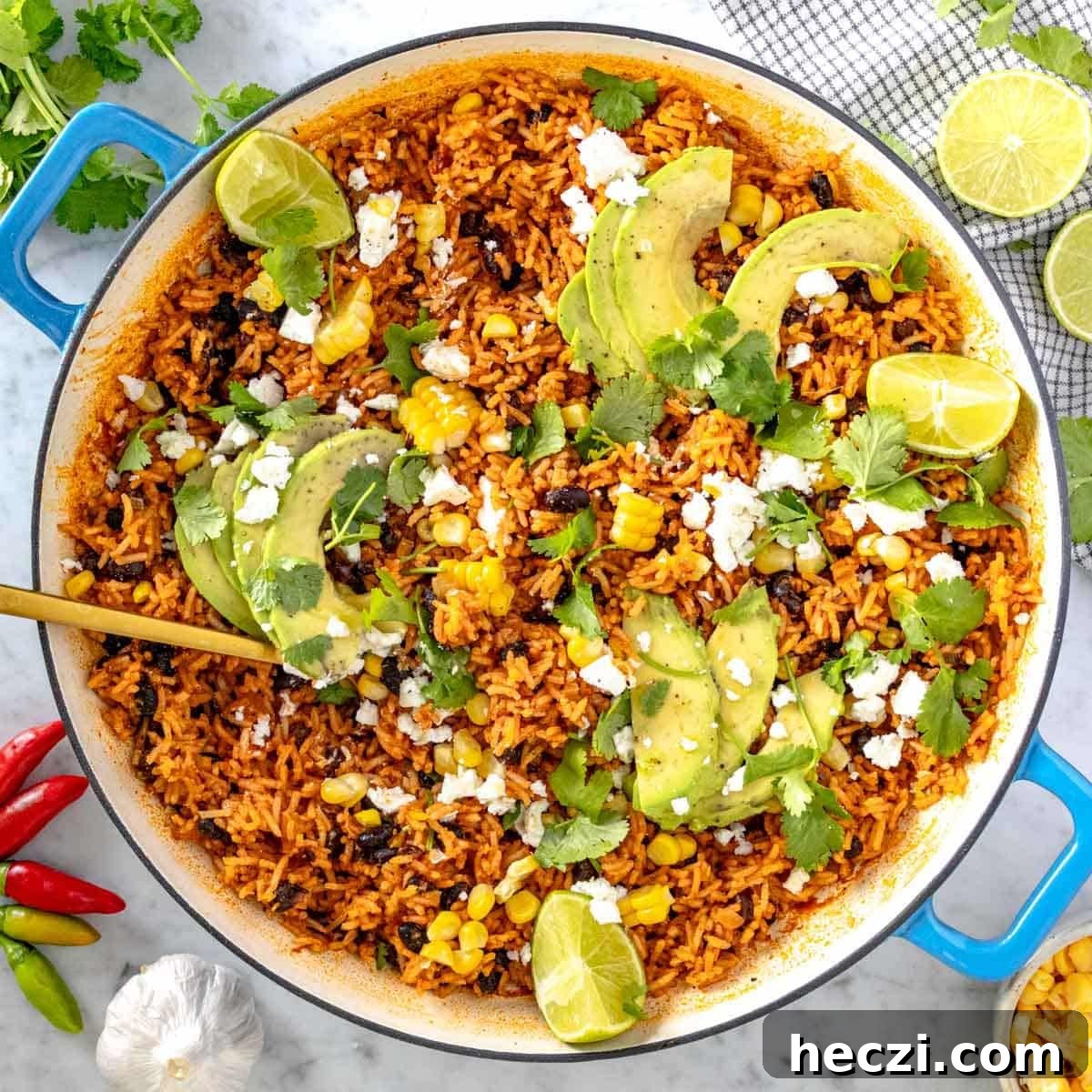 19 Budget-Friendly Bean Recipes to Save You Money Weekly 12 Mexican rice with avocado and cilantro in a skillet