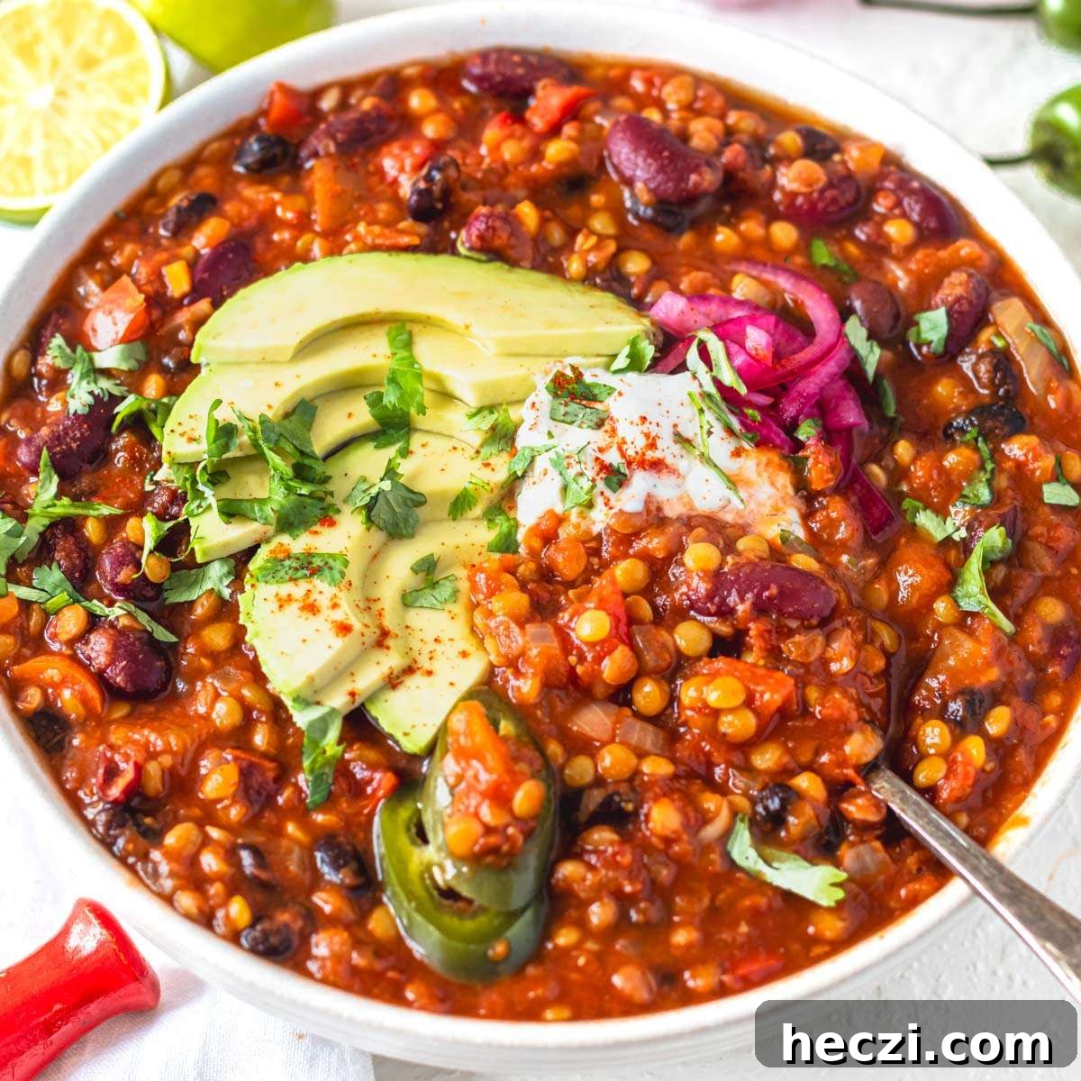 19 Budget-Friendly Bean Recipes to Save You Money Weekly 15 Lentil chili topped with avocado and sour cream.