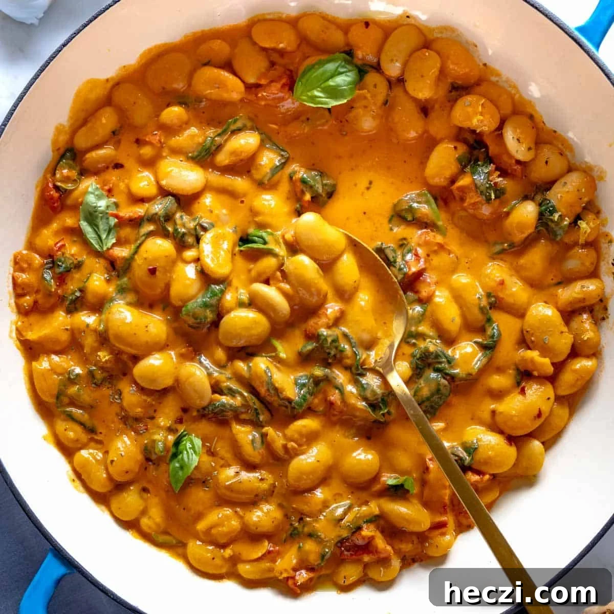 19 Budget-Friendly Bean Recipes to Save You Money Weekly 16 Marry me butter beans in a blue skillet.
