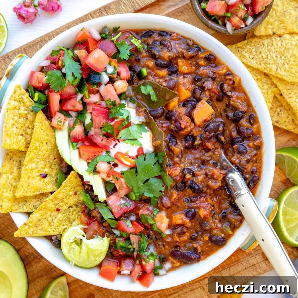 19 Budget-Friendly Bean Recipes to Save You Money Weekly 10 Black bean soup in a white bowl as a healthy soup meal.