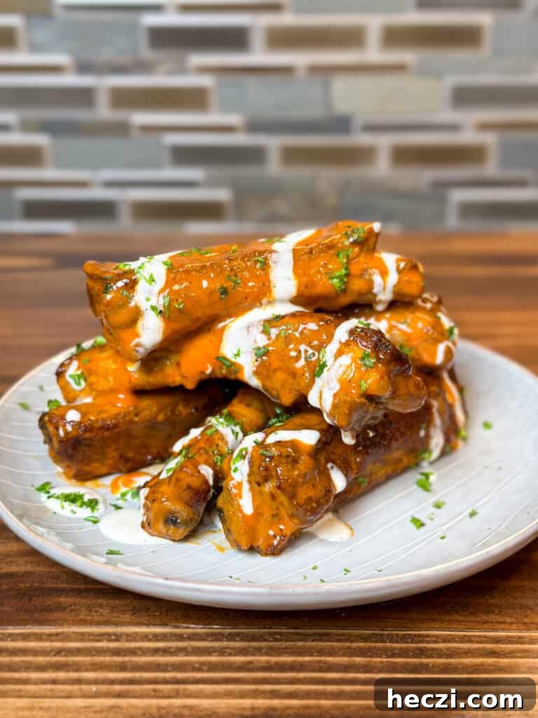 Pork spare ribs covered in buffalo sauce and ranch 