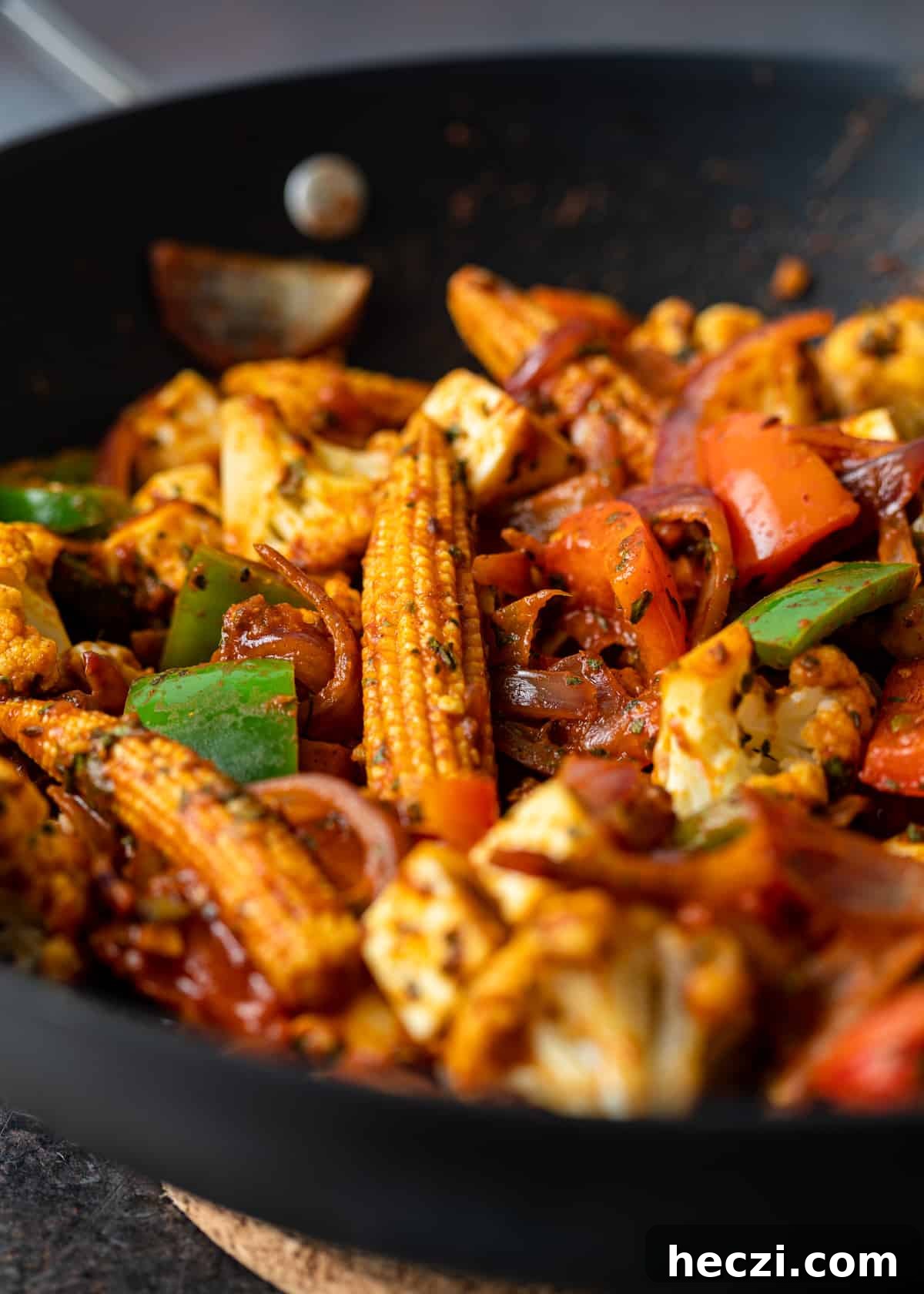 Vegetable Jalfrezi Stir-Fry Recipe: Quick Spicy Indian Veg Stir-Fry 3 closeup: baby corn and cut bell peppers for jalfrezi in wok