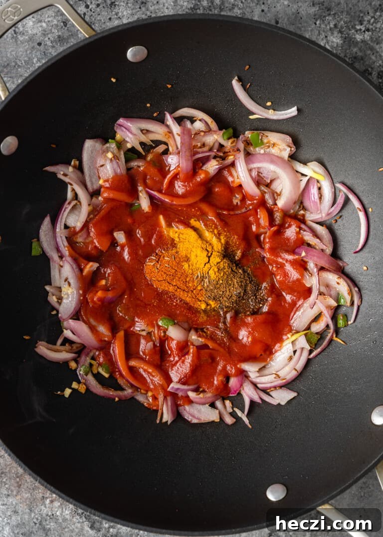 Vegetable Jalfrezi Stir-Fry Recipe: Quick Spicy Indian Veg Stir-Fry 8 overhead process shot: onions and seasonings in a wok
