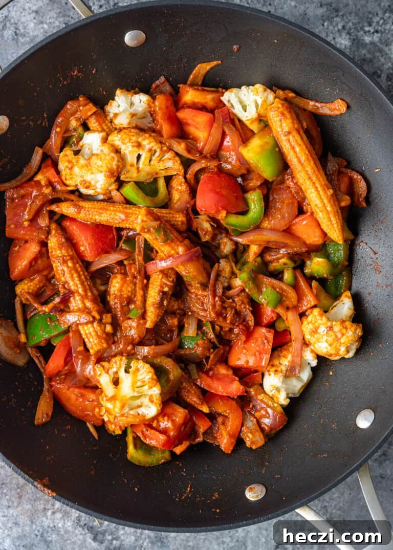 Vegetable Jalfrezi Stir-Fry Recipe: Quick Spicy Indian Veg Stir-Fry 9 overhead process shot: veggie jalfrezi cooking in a wok