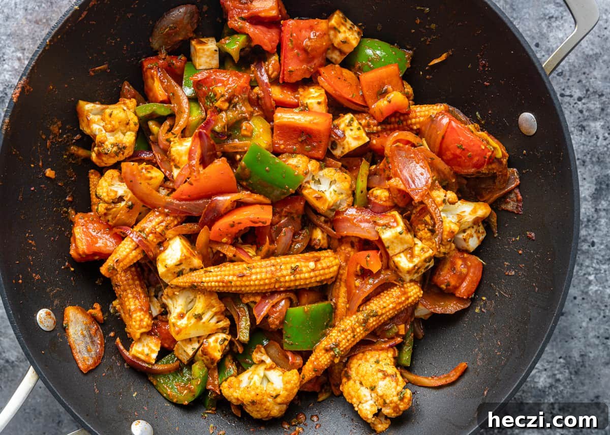 Vegetable Jalfrezi Stir-Fry Recipe: Quick Spicy Indian Veg Stir-Fry 10 overhead: cooked vegetable jalfrezi in a wok