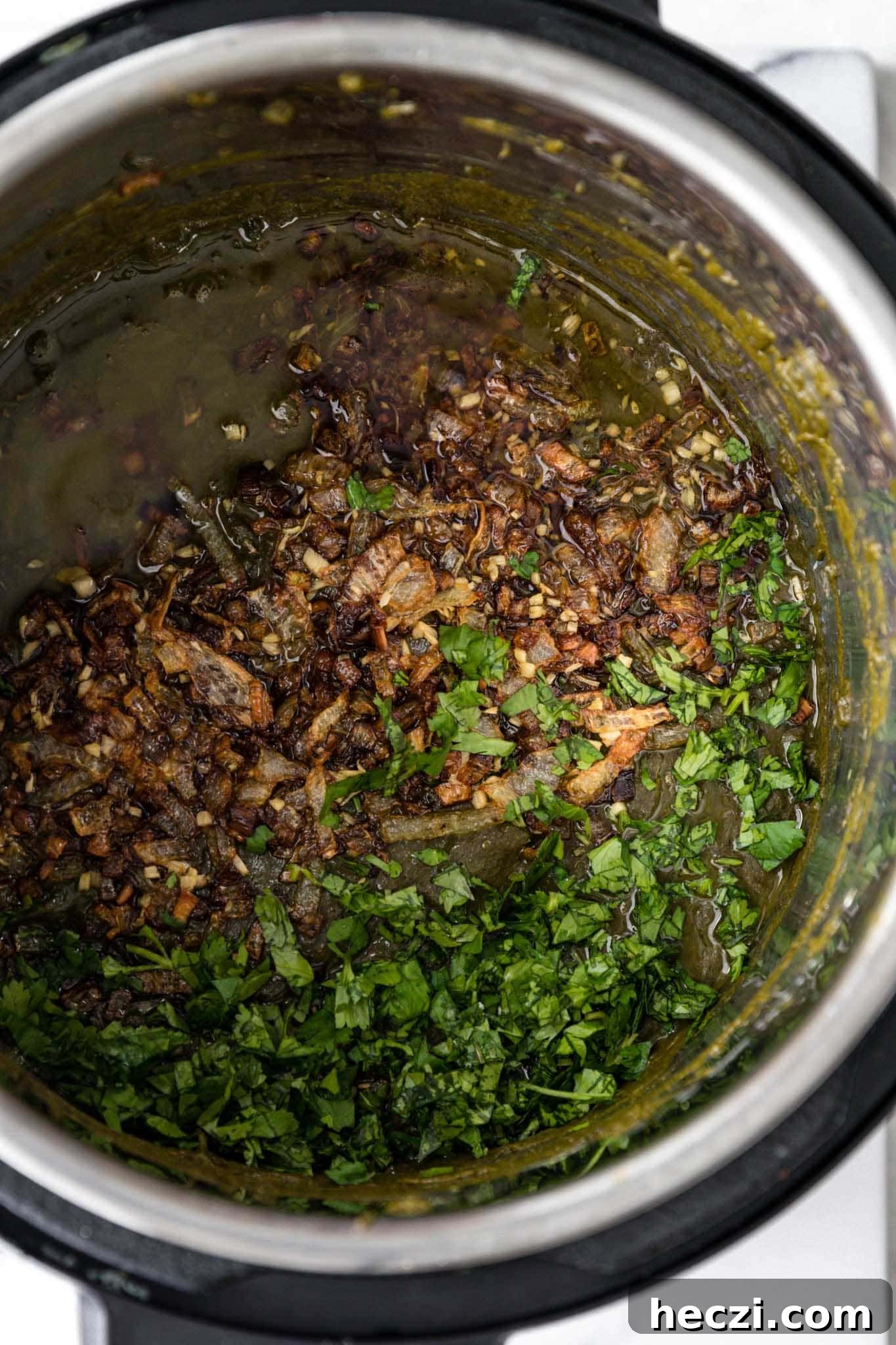 Tadka added to instant pot Sarson Ka Saag along with chopped cilantro