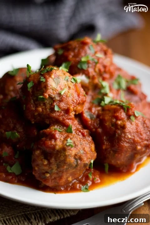 Slow Cooker Meatballs on a plate with parsley scattered on top
