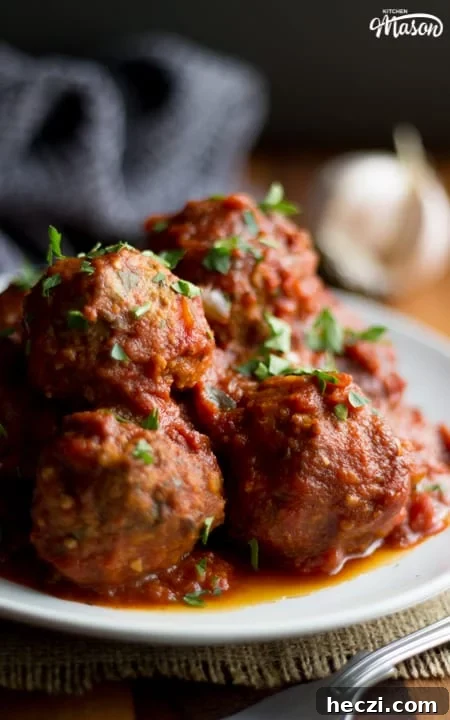 Slow Cooker Meatballs on a plate with parsley scattered on top