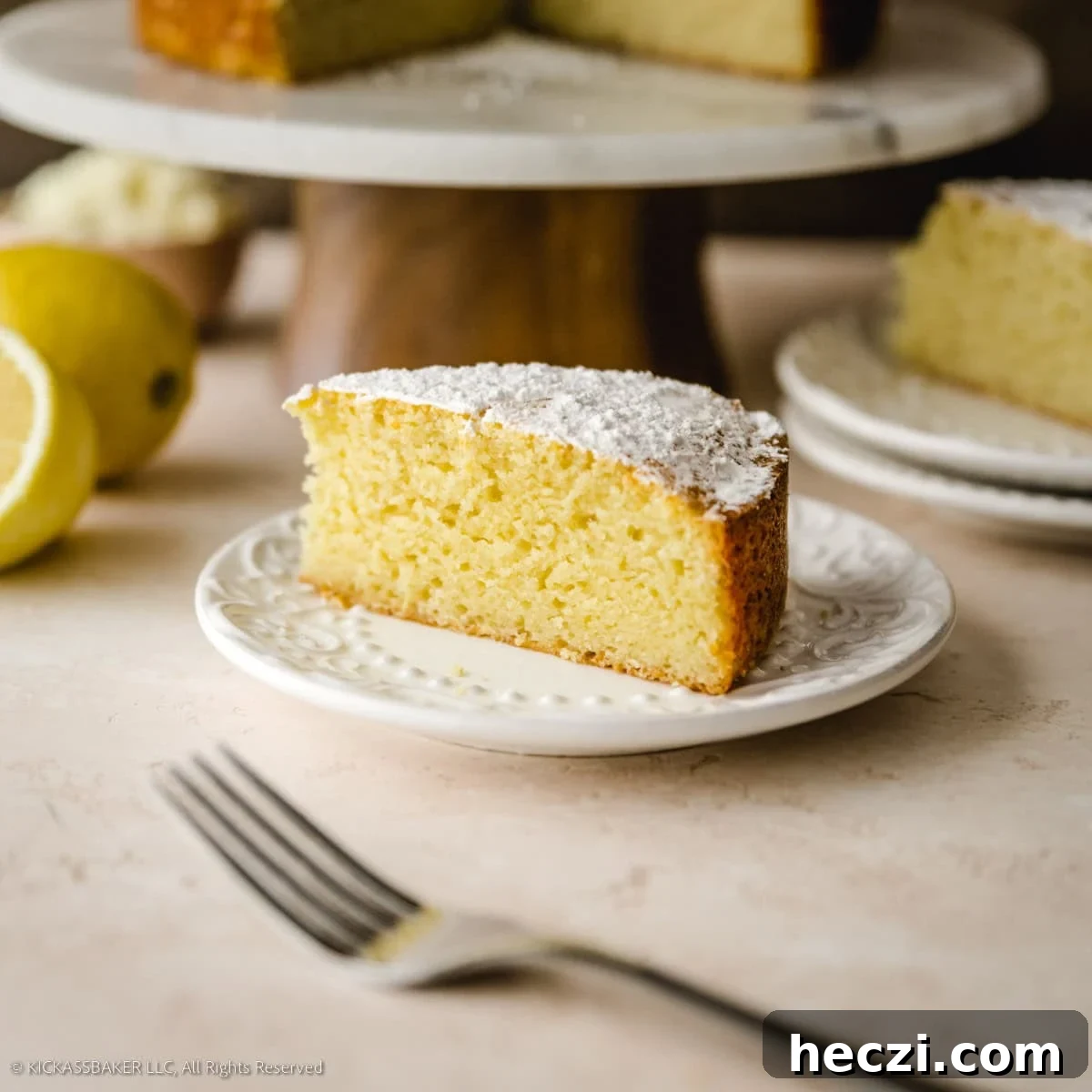 Quick Homemade Ricotta Cheese in Under 30 Minutes 22 A slice of obsession worthy lemon ricotta cake on a plate.