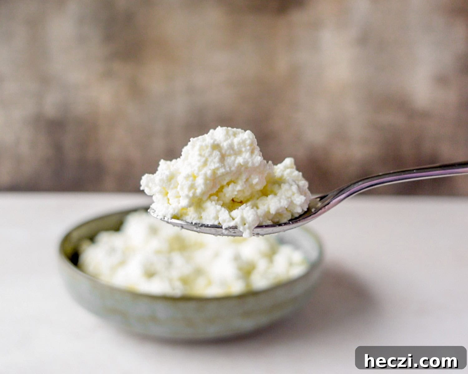 Quick Homemade Ricotta Cheese in Under 30 Minutes 5 Texture of homemade ricotta made in 30 minutes.