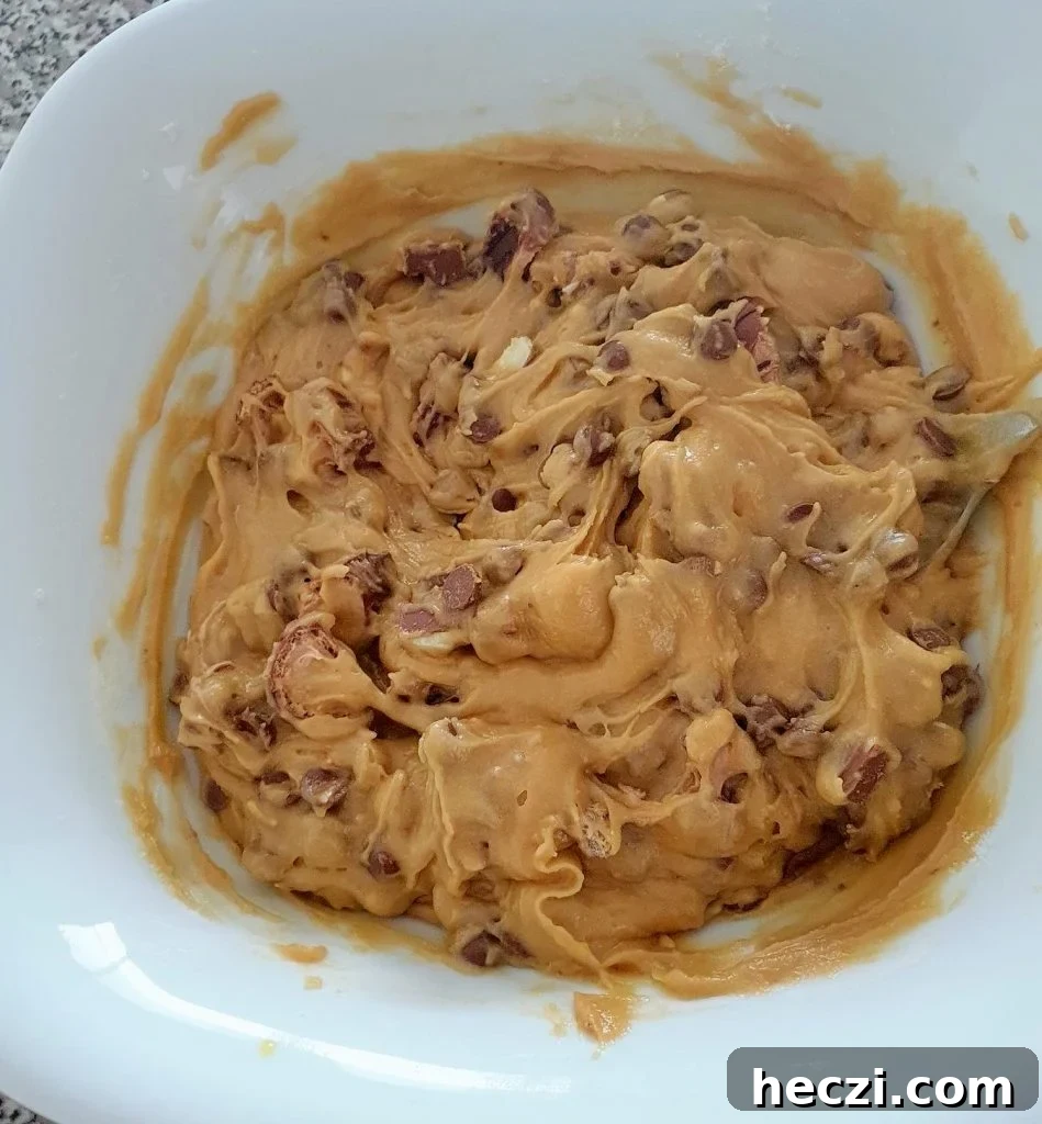 Kinder Bueno Cookie Pie Recipe — Hazelnut Chocolate Dessert Pie 8 Kinder Bueno cookie dough in a bowl.