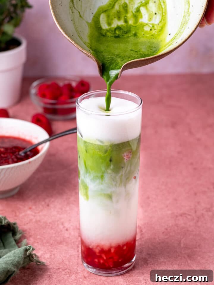 adding matcha to the raspberry matcha latte