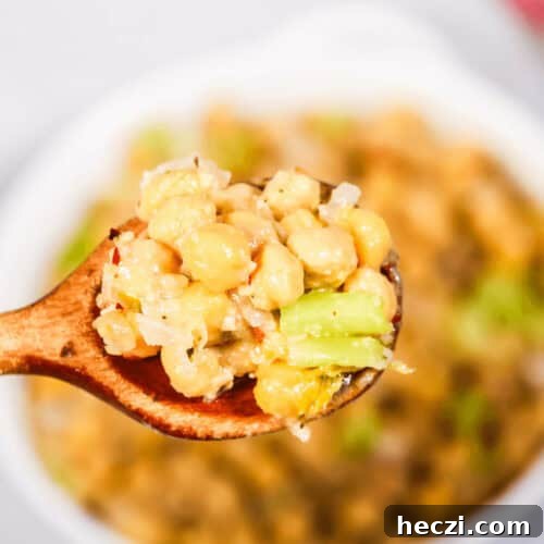 A spoon of the marinated chickpea salad.