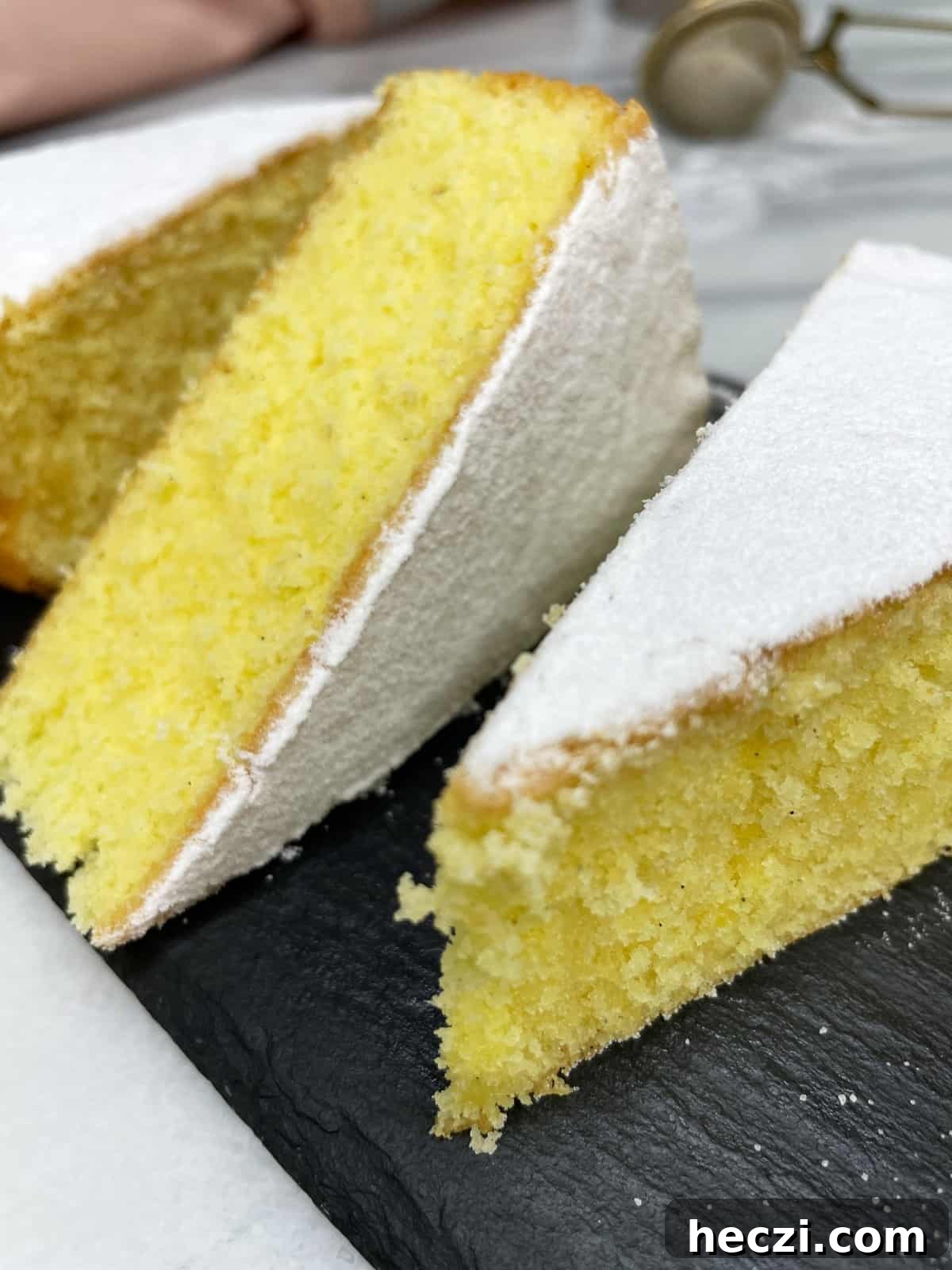Sliced Paradise cake on a black serving board