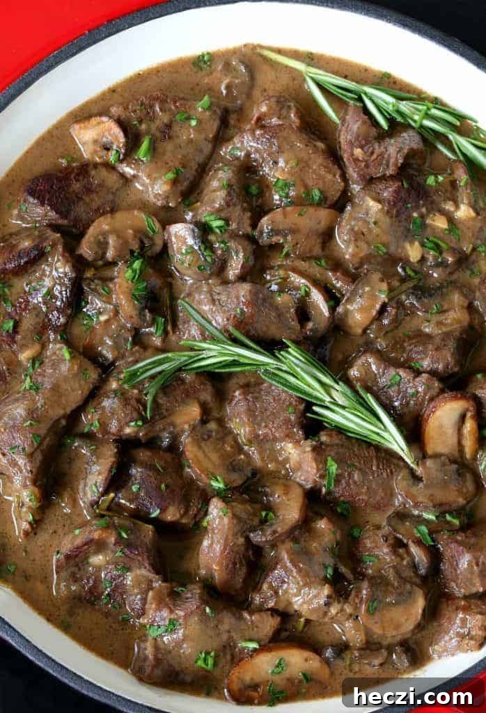 Marsala Braised Beef Steewith Mushrooms and Red Wine Sauce 2 Marsala Wine Beef Stew in a pot with rosemary