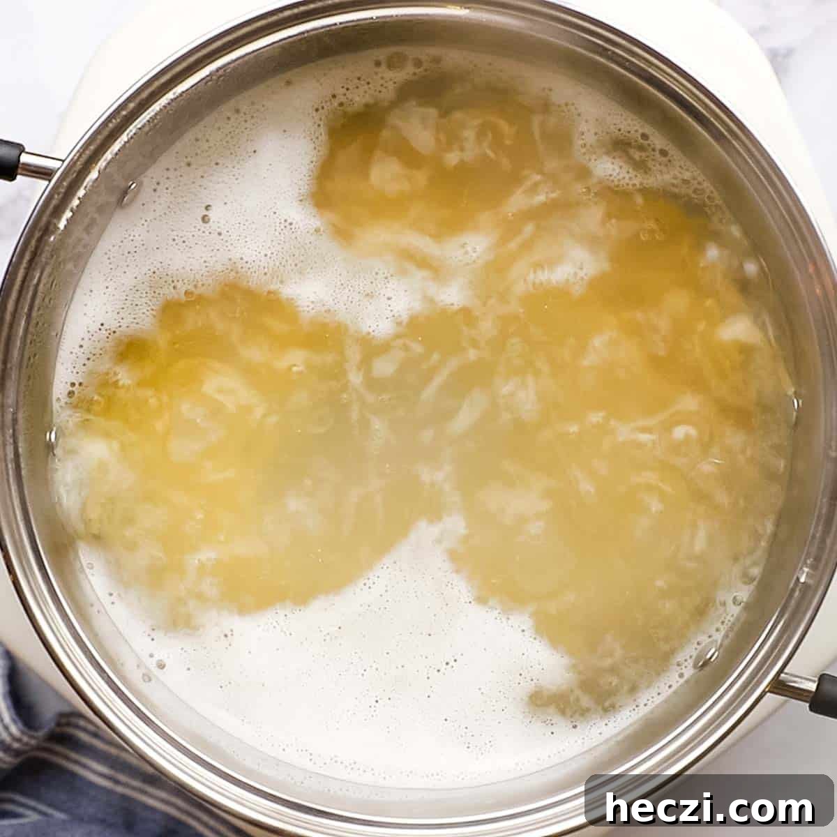 boiling spaghetti in a large bowl