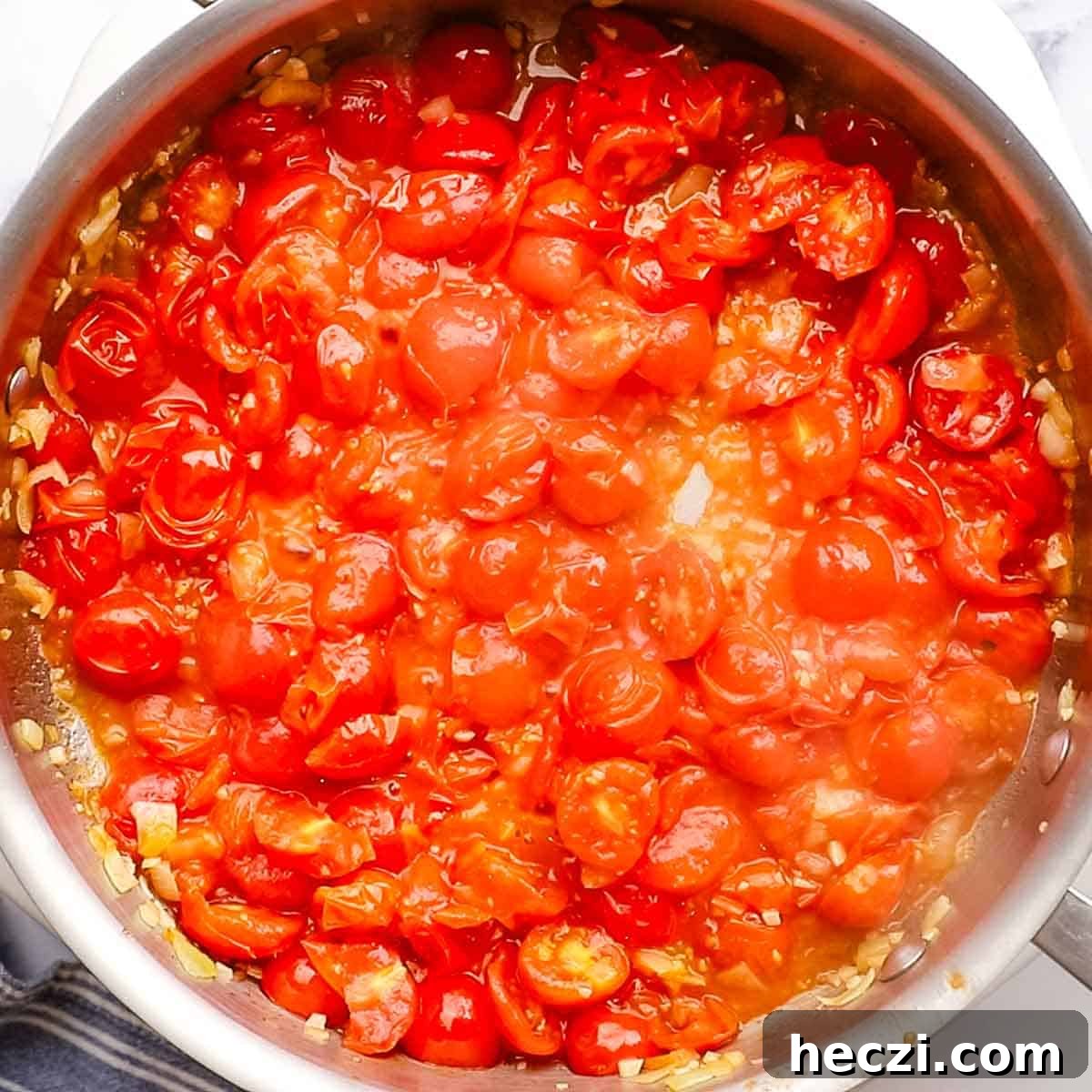 tomatoes cooking in the large skillet