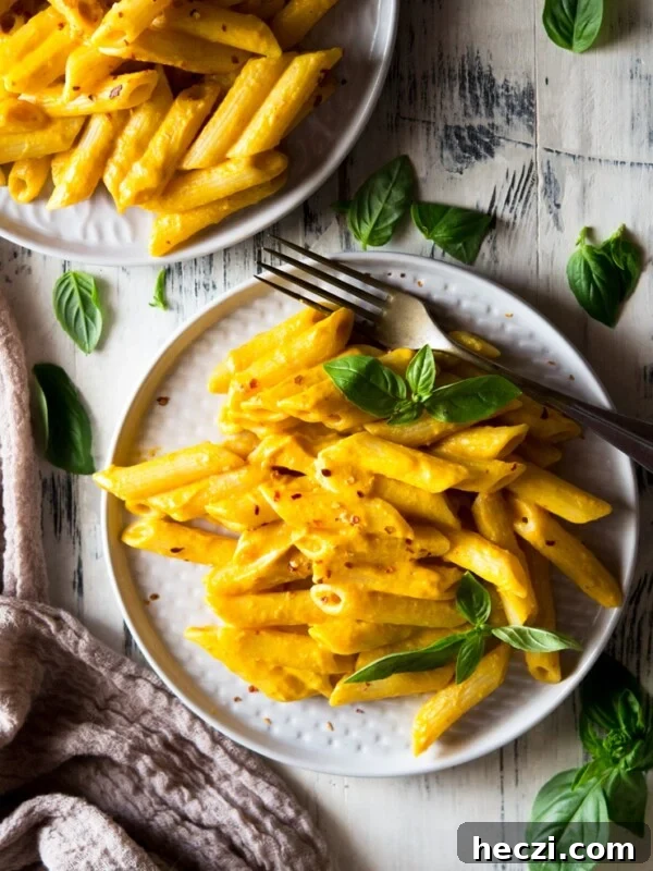 butternut squash pasta in a plate with basil