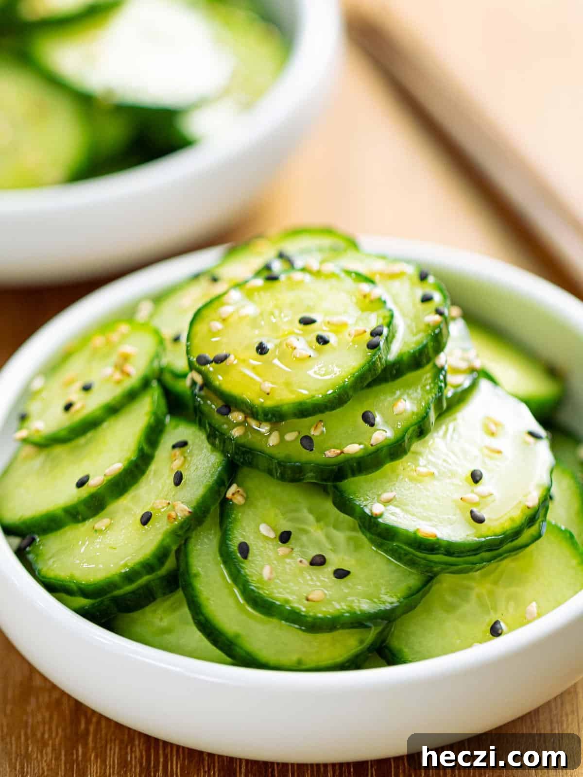 Sunomono, Japanese cucumber salad, in a white bowl.