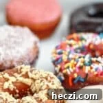 Light and Fluffy Gluten-Free Yeast Donuts Recipe 9 variety of gluten free yeast donuts in white box.